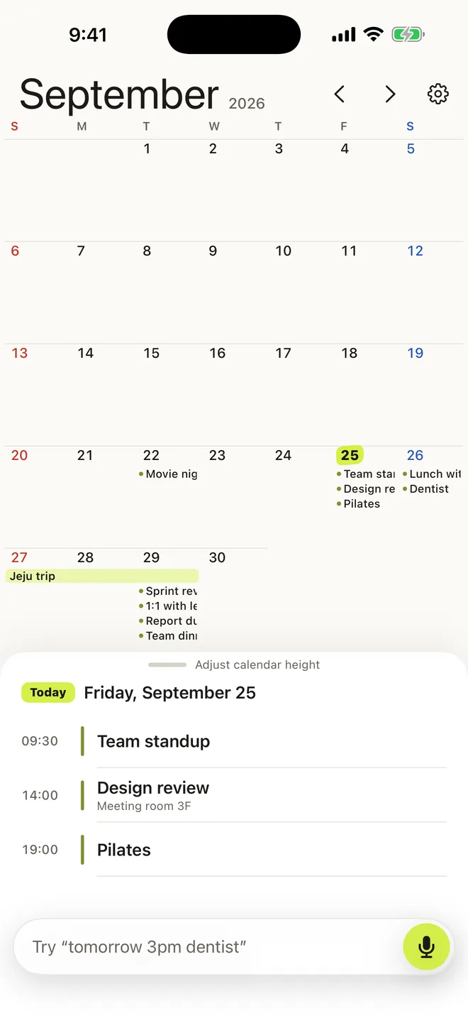Month view showing event titles inside each day and a multi-day trip as one bar